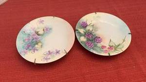 lot 1070 image: 2 Limoges Painted Porcelain Plates Floral Design with Hangers
