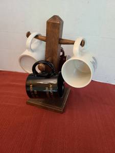lot 1205 image: Mugs on wooden holder