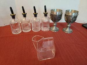 lot 1207 image: Pewter goblets, oil dispensers, glass pourer