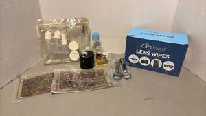 lot 1311 image: CareTouch Lens Wipes about 12 box.  Travel bottles and razors