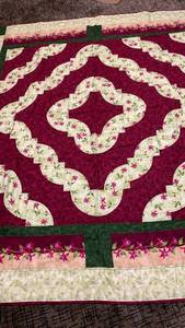 lot 1444 image: Handmade Quilt with Curved Pieced Border Burgundy Cream and Green 78X65