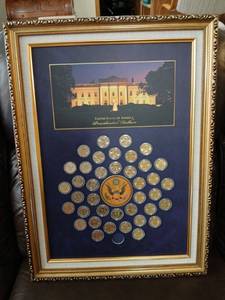 lot 2002 image: United States of America Presidential Dollars Framed Coin Collection 26x18.5 missing one coin