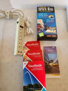 lot 3102 image: Storage space bag, power strip, various state tour books