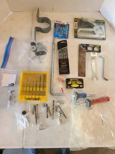 lot 3104 image: Drill bits, staple gun, staples, more