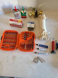 lot 3134 image: Black and Decker drill bit set, sewing machine oil, graphite lubricant, more