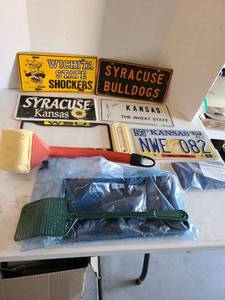lot 3139 image: License plates and covers, grill scrubber wand, thermometer