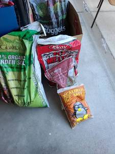 lot 3152 image: Full bag of rubber mulch nuggets, plus ice melt and organic garden soil