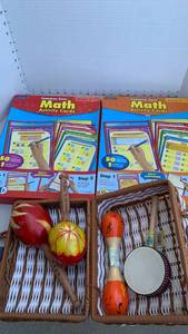 lot 3231 image: Launchpad Common Core Math Activity Cards Grade 4 & 5 and maracas