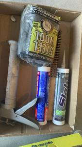 lot 3306 image: Caulking gun, caulk, wire brush and steel wool