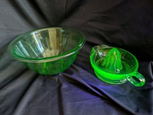 lot 1201 image: Uranium glass 2-Piece Green Glass Mixing Bowl and Citrus Juicer Set