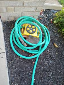 lot 963 image: Garden Hose with Sprinkler