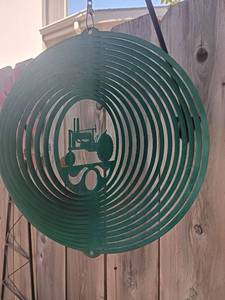 lot 975 image: Metal Hanging and Spinning Tractor.   11 x 11