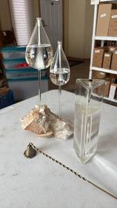 lot 1112 image: Glass Teardrop Domes with Mineral Base and Brass Snuffer with Triangle Candle to match
