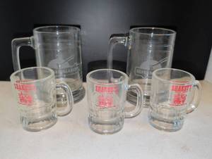 lot 1135 image: Shakeys Pizza Parlor Glass Mugs and Silver Dollar City Steins