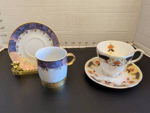 lot 1155 image: Duchess Bone China Teacup and Saucer and EPIAG tea cup set in a beautiful gilt golden holder