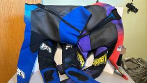 lot 1387 image: Two wetsuits Large and Small (man and woman)