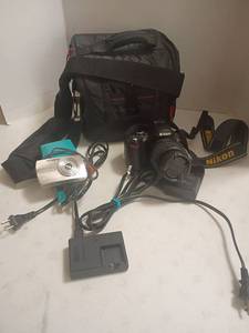 lot 2030 image: Nikon Camera with Case and Olympus Camera with Case