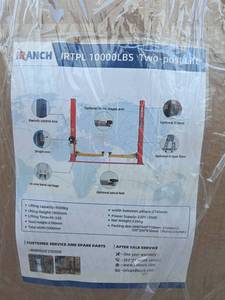 lot 8022 image: Unused 2025 IR TPL (1) Two Post Car Lift 10,000 LBS (Red)