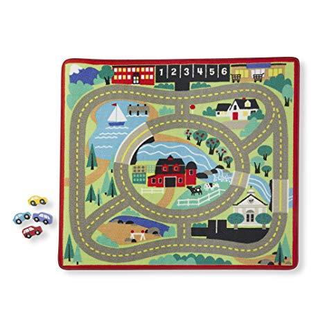 lot 17 image: Doug & Melissa Round the Town Road Rug with 4 Wooden Cars