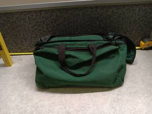 lot 1383 image: Green Canvas Duffel Bag with Black Trim
