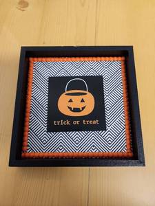 lot 71029 image: Halloween Trick or Treat Framed Wall Art with Pumpkin Design - Retail $5