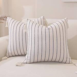 lot 2194 image: QDTTSRY Decorative Boho Throw Pillow Covers 18x18 Inch Set of 2, Navy Blue Striped Square Neutral Pillow Covers with Tassels, Soft & Cozy Farmhouse Couch Pillow Cases for Sofa Couch Bed Living Room