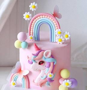 lot 12081 image: Bach and Boozy Rainbow Unicorn Cake Topper Set