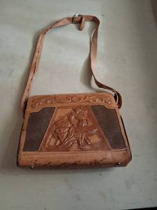 lot 150 image: Tooled Leather Shoulder Bag with Embossed Figures and Hair-On Panels