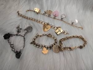 lot 4512 image: Charm Bracelets with Heart Cross and Pendant Charms