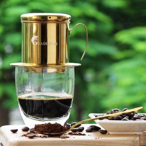 lot 879 image: Pre Owned Vietnamese Coffee Maker Filter Phin, Small French Press Portable Cup, Single Serve Coffee Makers, Gift for coffee lovers (Gold, 1) - Retail $30