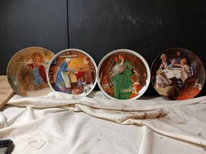 lot 34051 image: Set of four round decorative collector plates, vintage fine china pieces featuring classic illustrative artwork