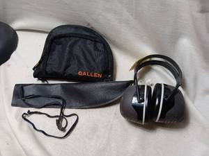 lot 33968 image: Black Allen brand pouch, black leather sheath with a lanyard, and a pair of black over-the-head safety earmuffs.