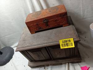 lot 33978 image: Vintage carved wooden jewelry or keepsake box featuring a hinged lid with an integrated interior mirror. Along with vintage wooden shoe shine box containing a brush, tins of Kiwi polish, and a polishing cloth.