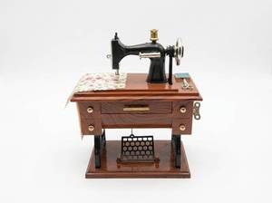 lot 63676 image: Vintage Black Sewing Machine Music Box