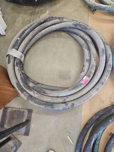 lot 15829 image: Large Diameter Hose Coil with Cam-Lock Style End Fitting