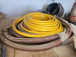 lot 15840 image: Yellow Garden Hose Coil with Brass Connectors