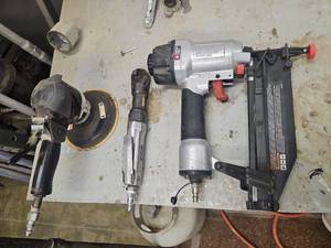 lot 15855 image: Porter-Cable Pneumatic Air Tool, Brad Nailer, Angle Grinder, Orbital Sander, and Impact Driver