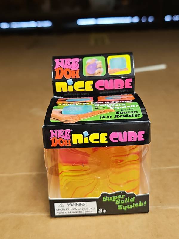 lot 63969 image: NeeDoh Nice Cube Sensory Toy - YellowRed Swirl