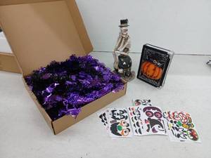 lot 10325 image: Halloween Decoration Set w Skeleton, Pumpkin Book, Pop Up Tree, And Stickers
