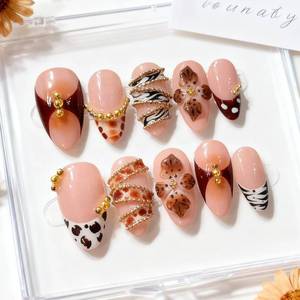 lot 40121 image: Almond Press-On Nails Nude Pink with Leopard Print & Gold Beaded Chains 24pcs
