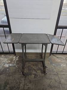 lot 1052 image: Metal Folding Work Table with Drop Leaves and Casters