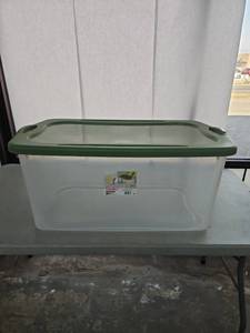lot 1067 image: Sterilite Extra Large Storage Bin 120 Quart EZ Carry Clear Plastic Storage Container with Snap-On Lid Green