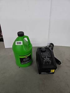 lot 1089 image: Low Lying Fog Juice 1 Gallon 3.78L with Skull Skeleton Fog Machine