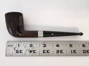 lot 2009 image: Smoking pipe with metal band and stem