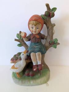 lot 2046 image: Figurine Child with Goose and Tree Branch