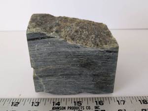 lot 2081 image: Raw Rock Mineral Specimen Green-Gray Banded Approx 4 x 3
