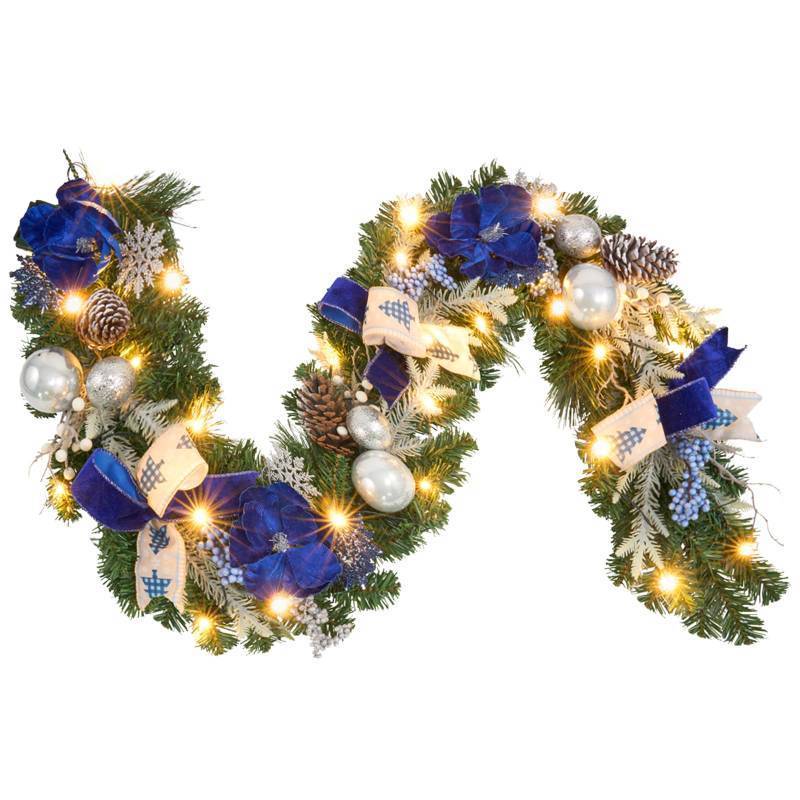 lot 1126 image: Pre-Lit Christmas Garland with Christmas Tree Icon Ribbon and Magnolia, 25 LED Lights with Timer, 6ft Lighted Silver Blue Garland for Front Door, Mantel, Holiday Decoration,Magnolia Winter Decor - Retail $50