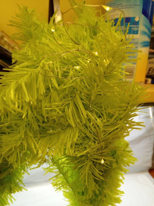 lot 1129 image: Grinch inspired Whimsical Table Top Small Christmas Tree, 2 FT Bendable Lime Green Christmas Tree with Lights and Red Ball, Curved Shape  - Retail $35