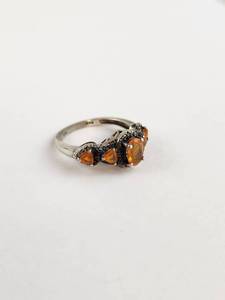 lot 124 image: Silver Ring with Orange Stones