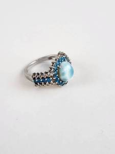 lot 142 image: Sterling Silver Ring with Light Blue Cabochon, Blue and Clear Stones